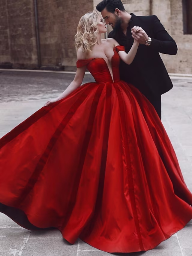 Elegant vintage off-shoulder ball gown with pleats and a sweep train.
