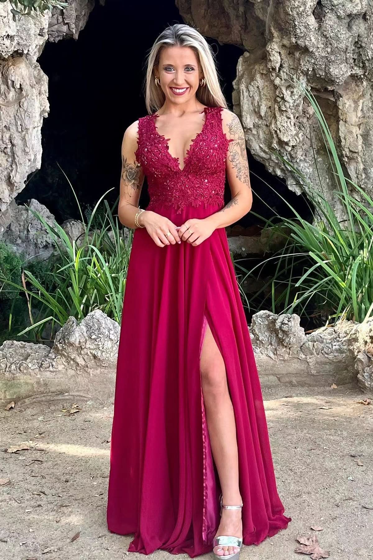 Full view of the red V-neck A-line prom dress with split and appliqués.