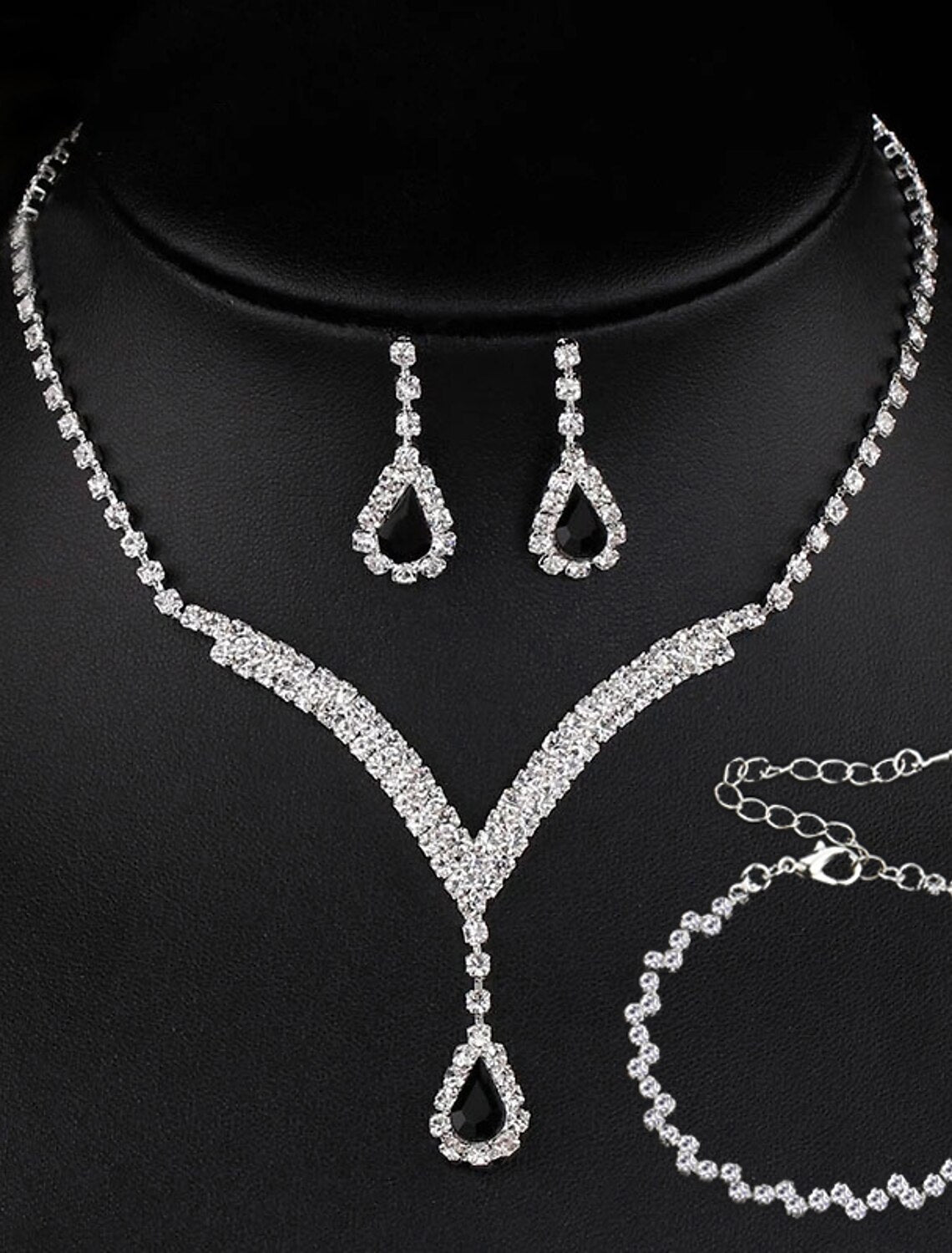 Close-up of vintage rhinestone necklace and matching earrings.