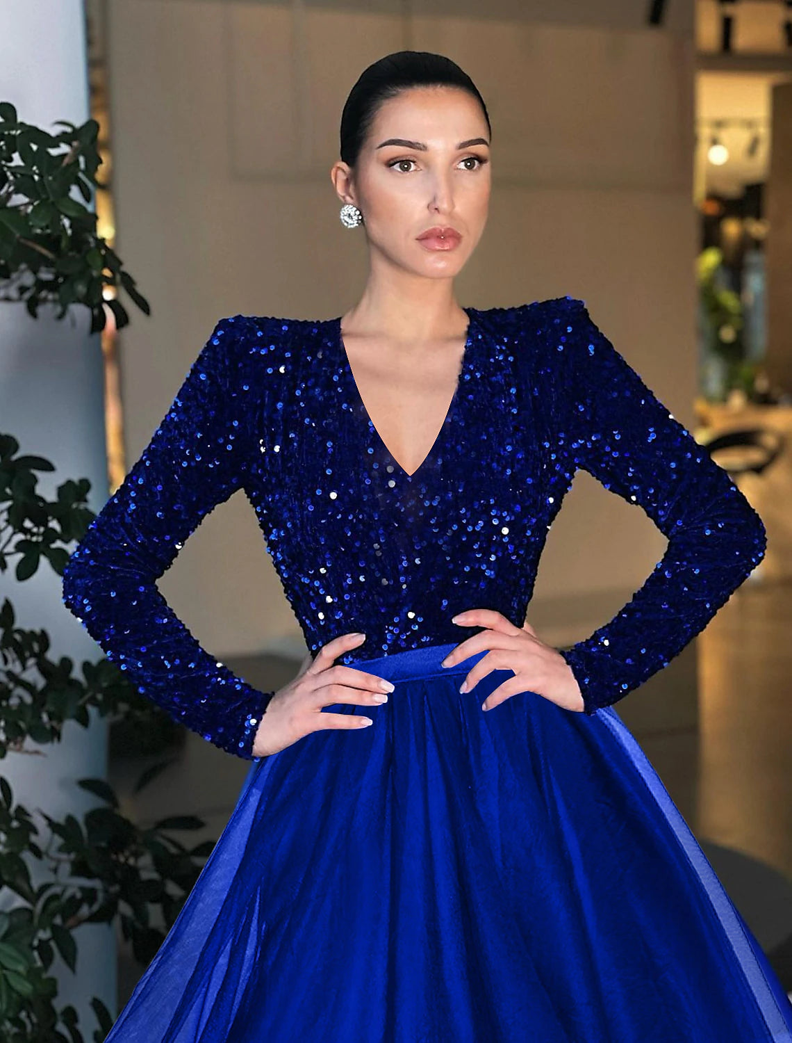 Elegant A-Line Ball Gown with long sleeves and jewel neck, adorned with sequins and tulle.