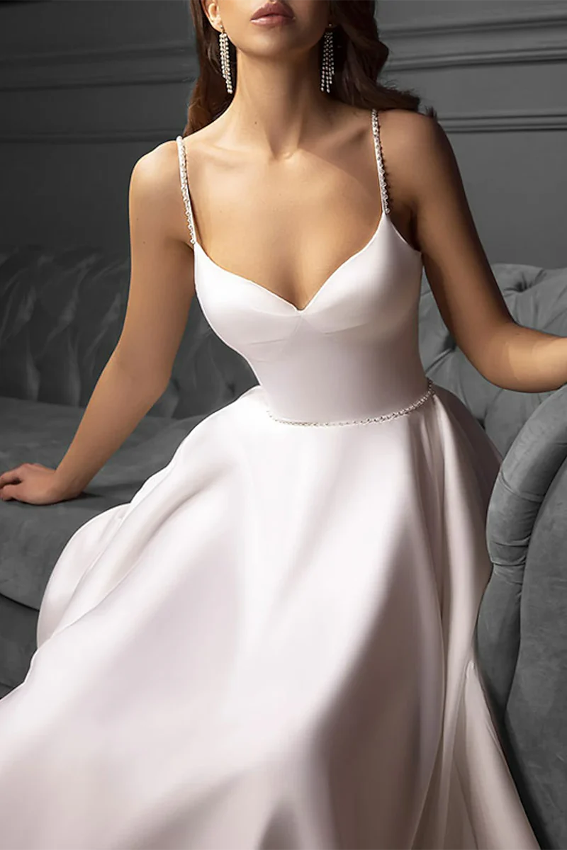 Back view of a vintage tea-length wedding dress, showcasing its elegant design.