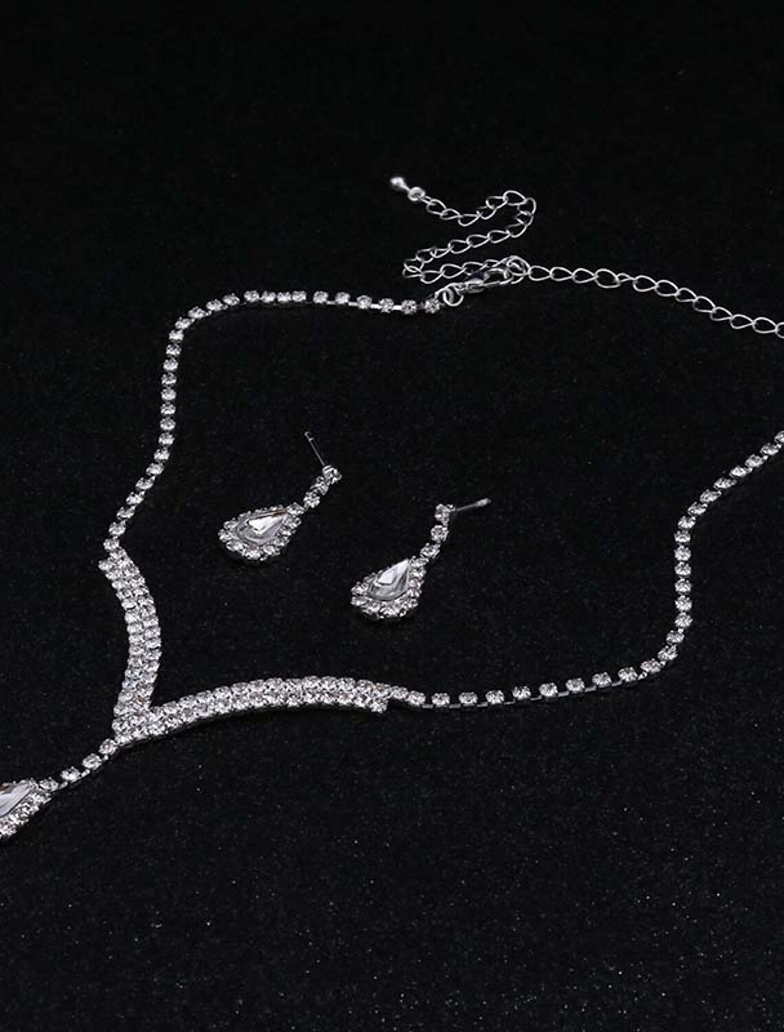 Close-up of the vintage teardrop synthetic diamond jewelry set, showing drop earrings and matching necklace.