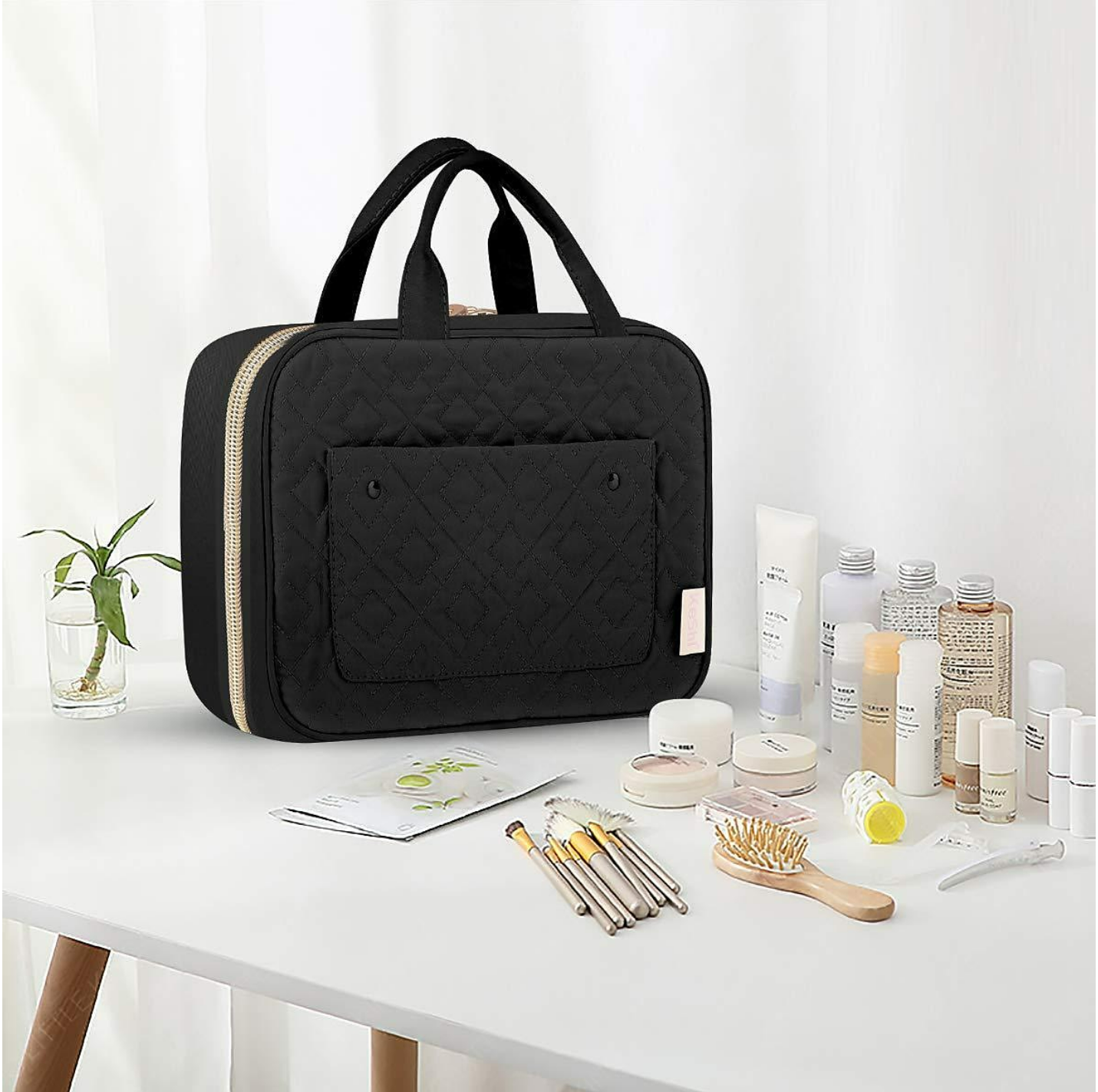 Toiletry bag neatly packed in a suitcase, ready for travel.