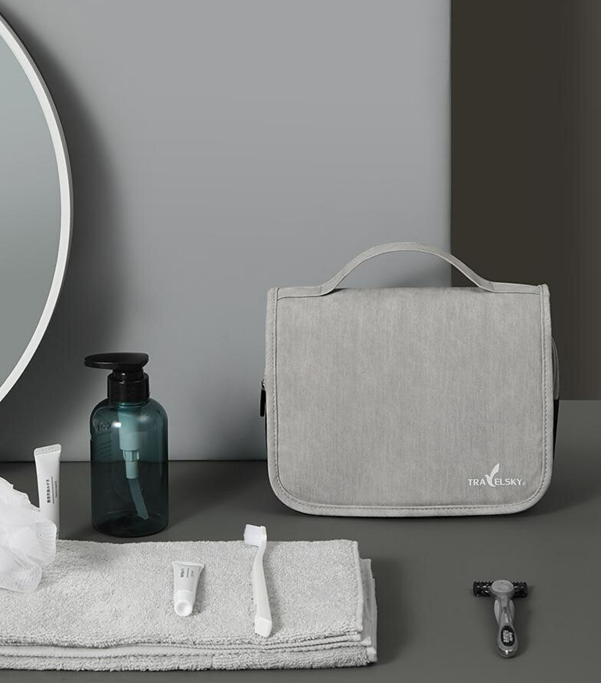 Water-resistant toiletry bag filled with various full-sized toiletries and cosmetics.