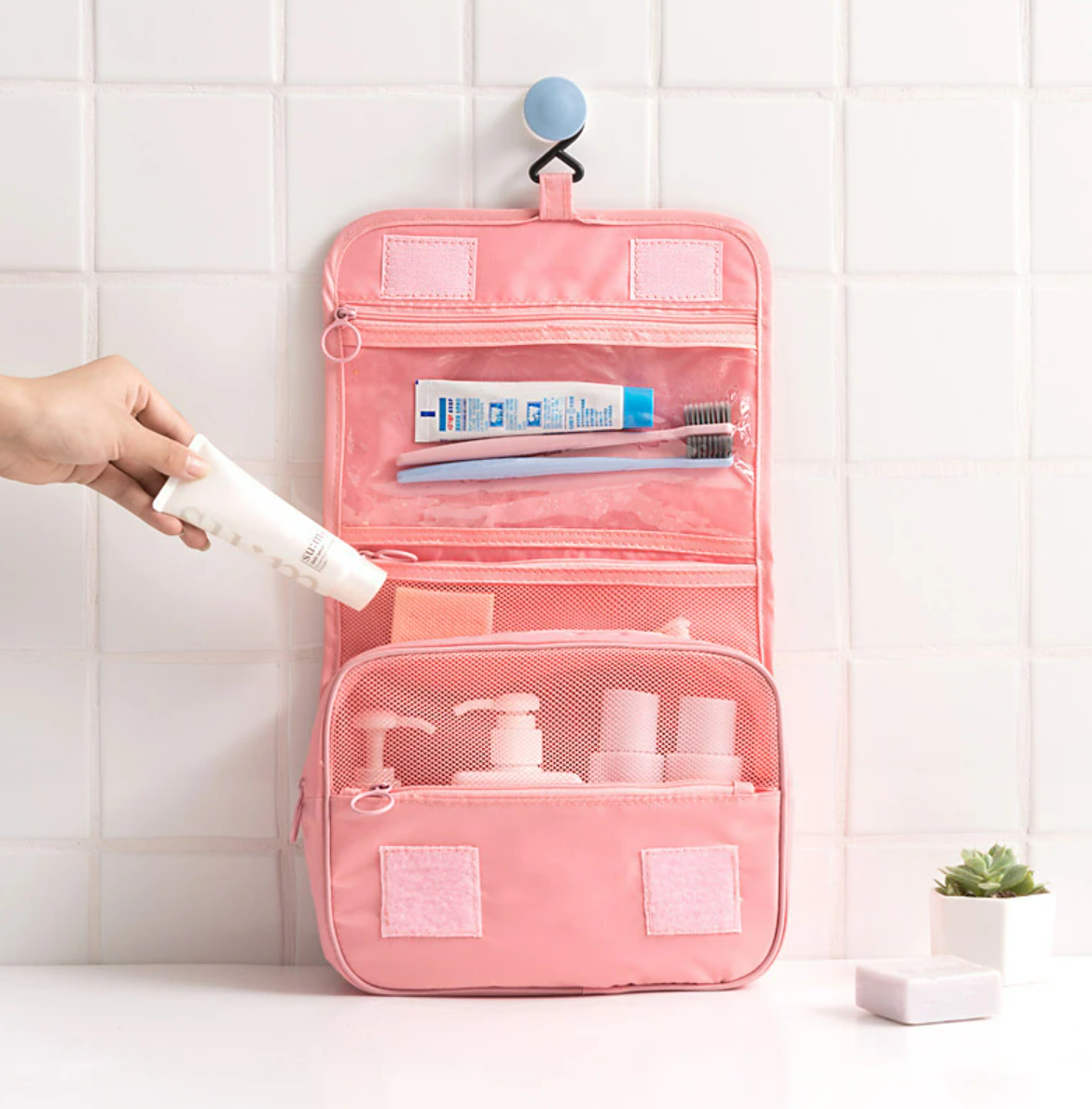 Open travel wash bag showing internal organization.