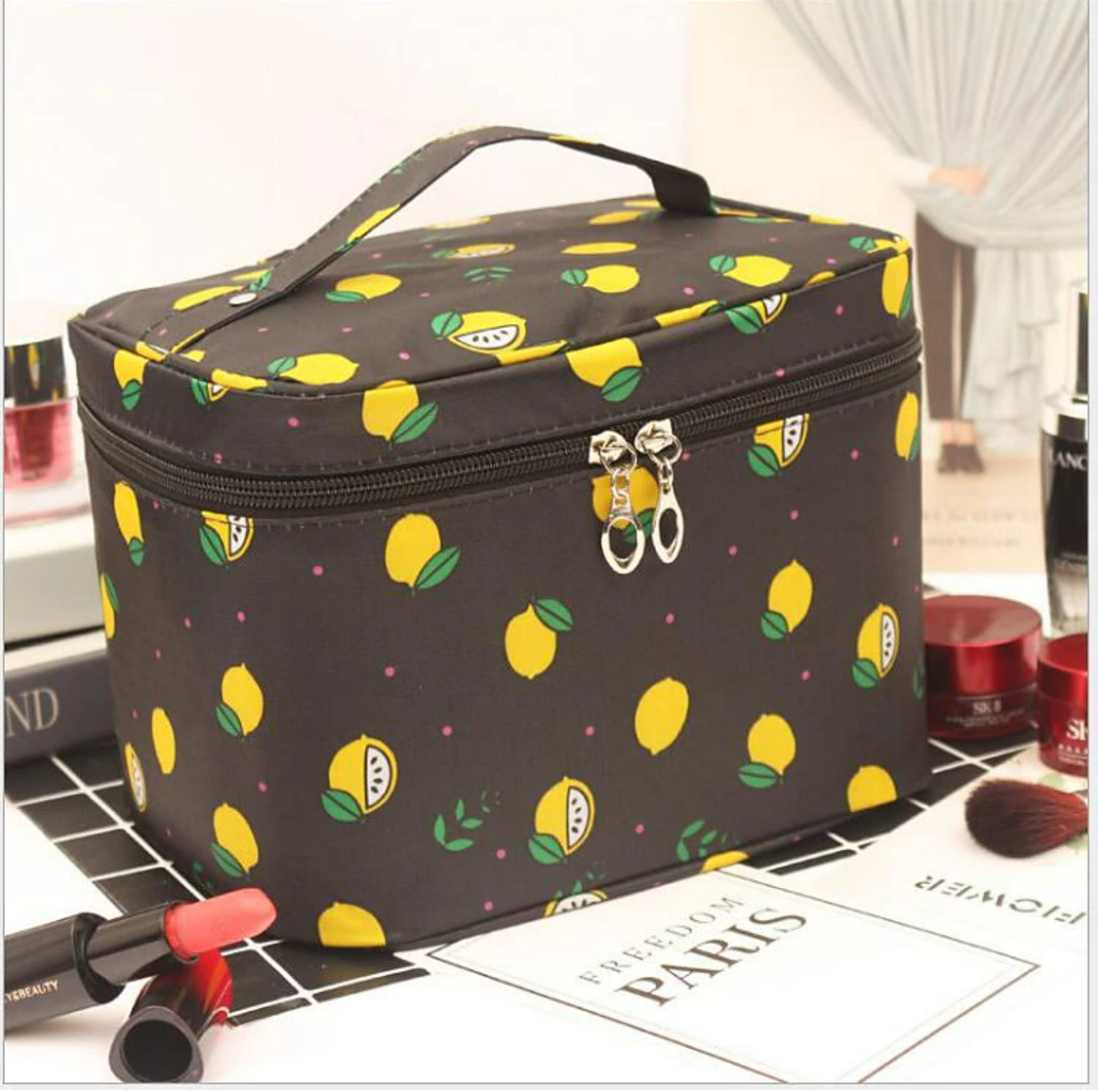 Open travel makeup bag showing spacious interior.