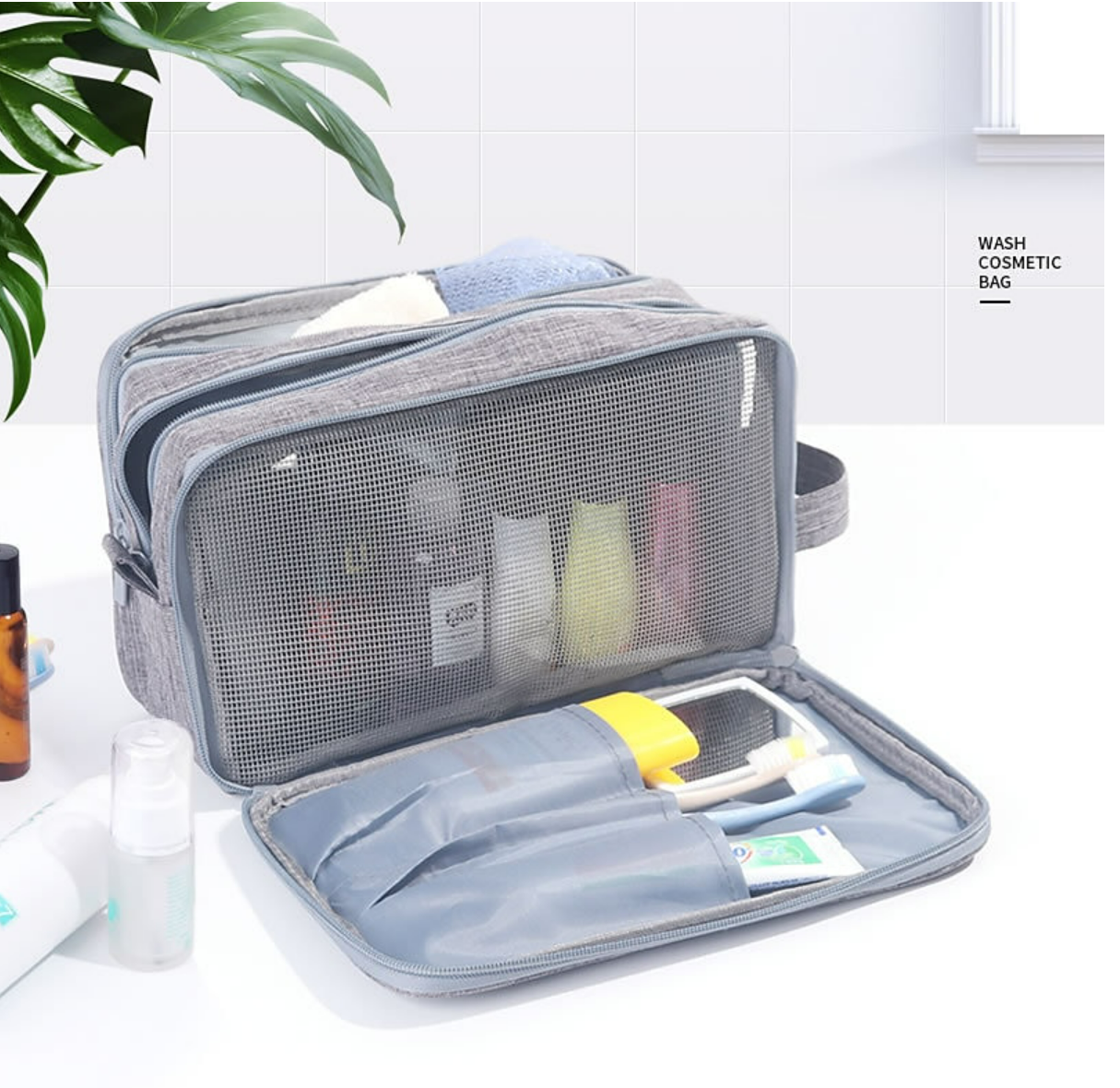 Black waterproof travel toiletry bag, closed with handle.