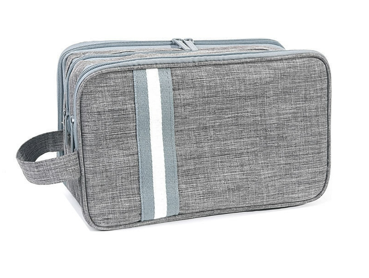 Open travel toiletry bag revealing multiple storage compartments.