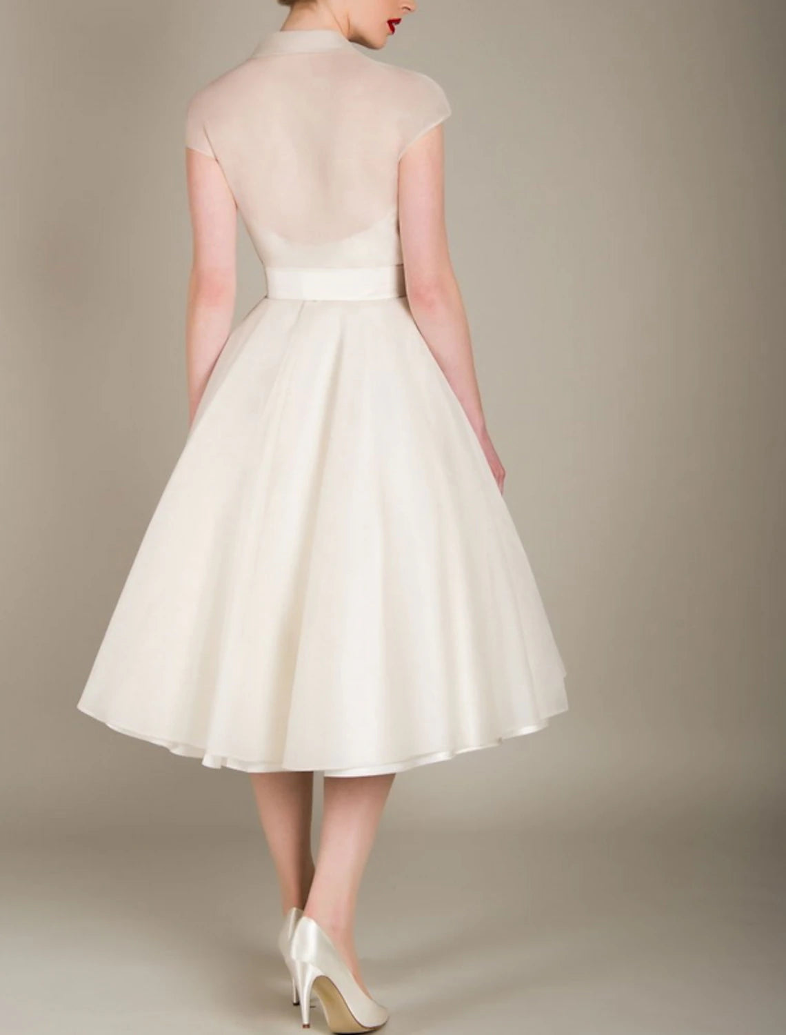 Close-up of the tulle fabric and sash detail on the A-Line cocktail dress.