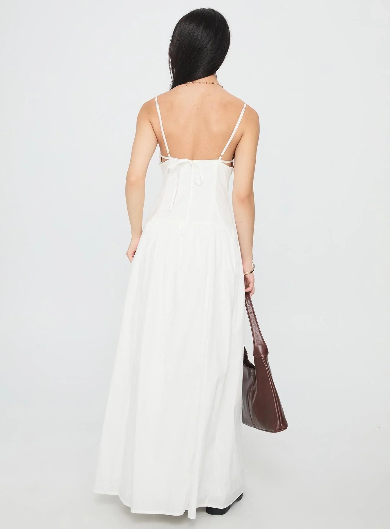 White Spaghetti Strap Prom Dress with Bow Detail and Flowy Skirt for Formal Events and Prom Nights