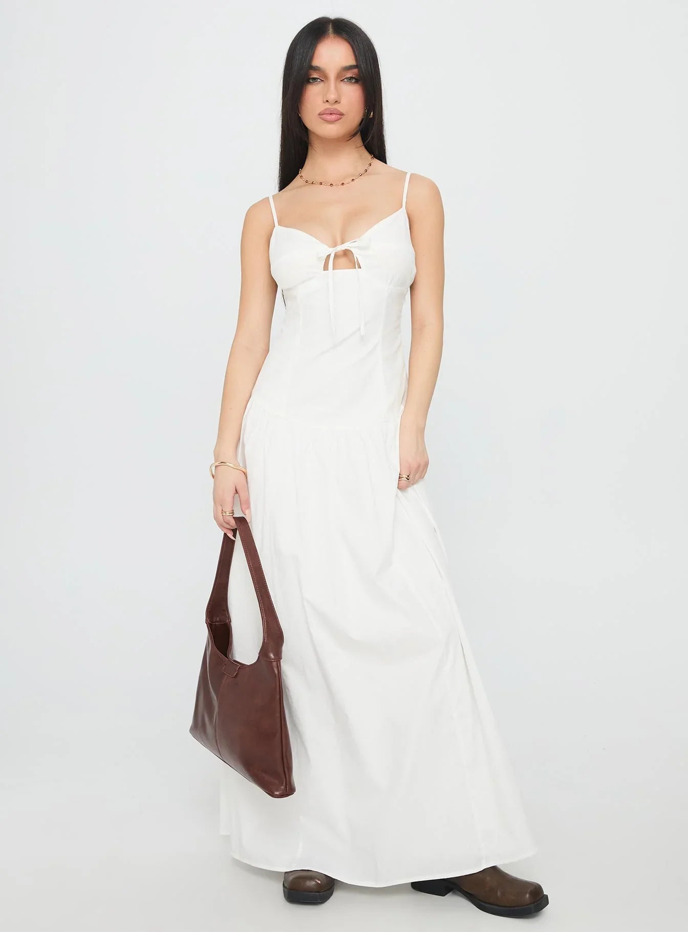 White Spaghetti Strap Prom Dress with Bow Detail and Flowy Skirt for Formal Events and Prom Nights