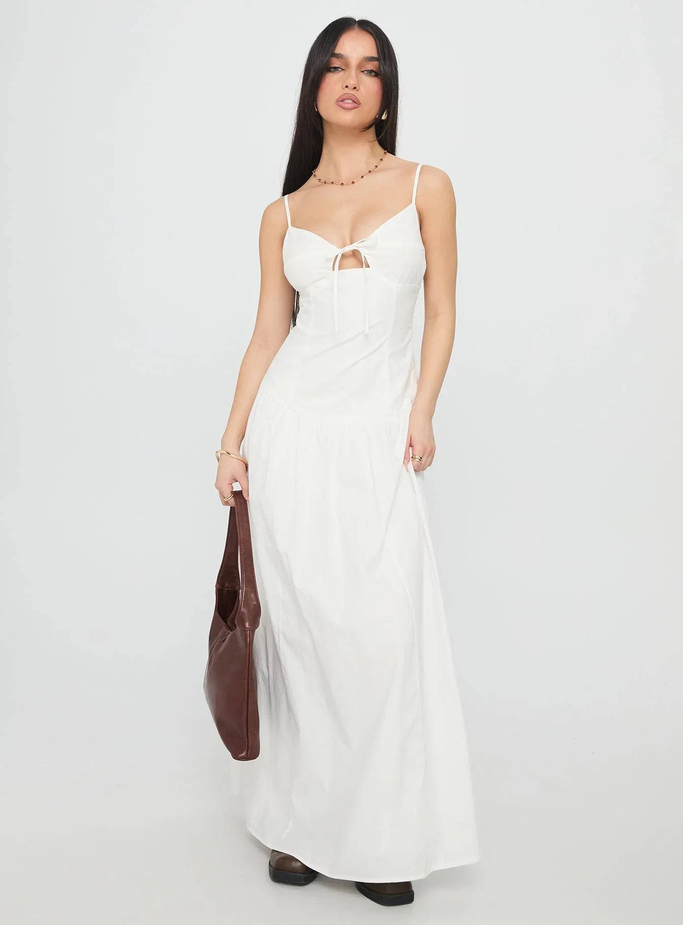 White Spaghetti Strap Prom Dress with Bow Detail and Flowy Skirt for Formal Events and Prom Nights