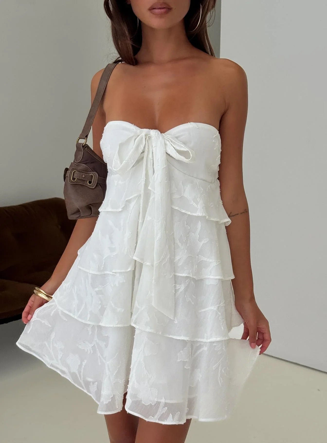 White Strapless Homecoming Dress with Tiered Ruffled Skirt and Bow Detail for Formal Events and Homecoming Nights