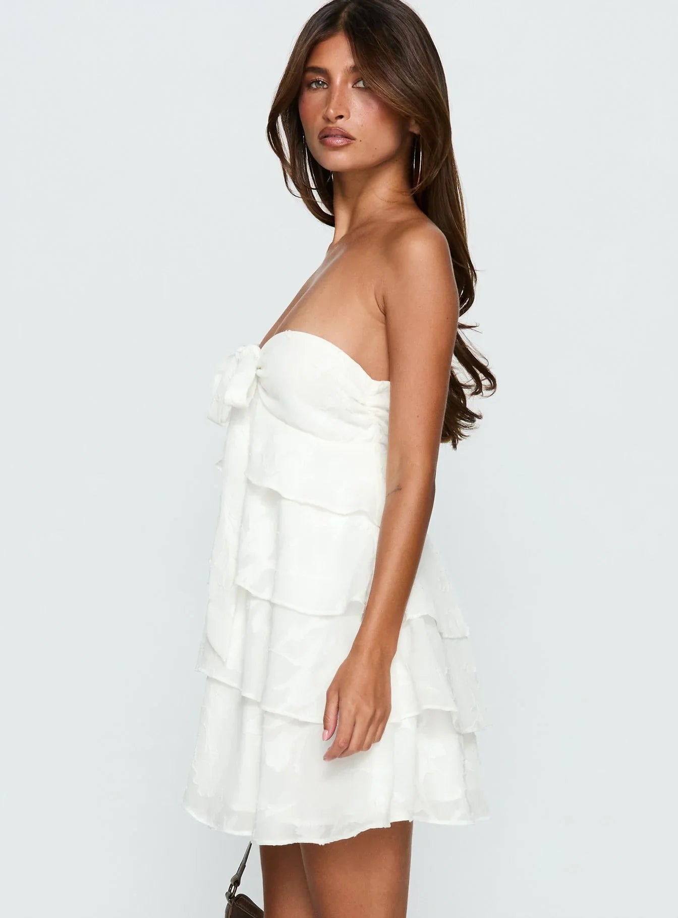 White Strapless Homecoming Dress with Tiered Ruffled Skirt and Bow Detail for Formal Events and Homecoming Nights