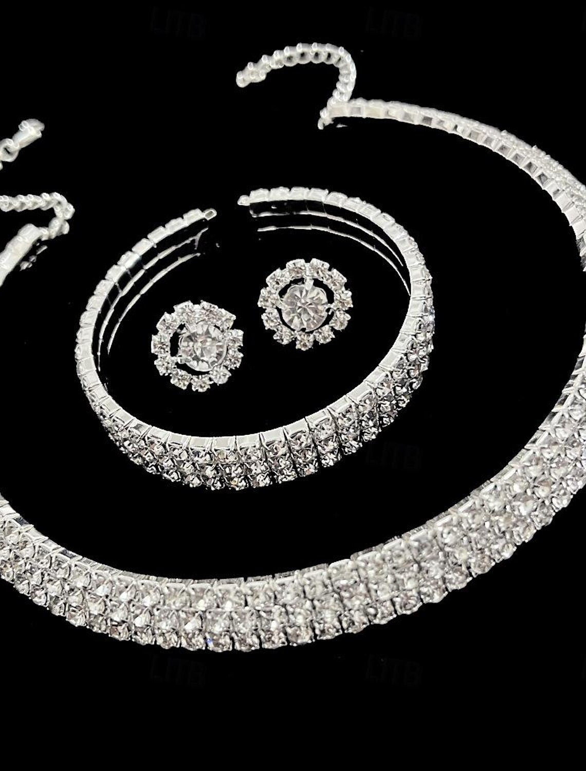 Detailed view of the alloy bracelet featuring flower and pear-round elements.