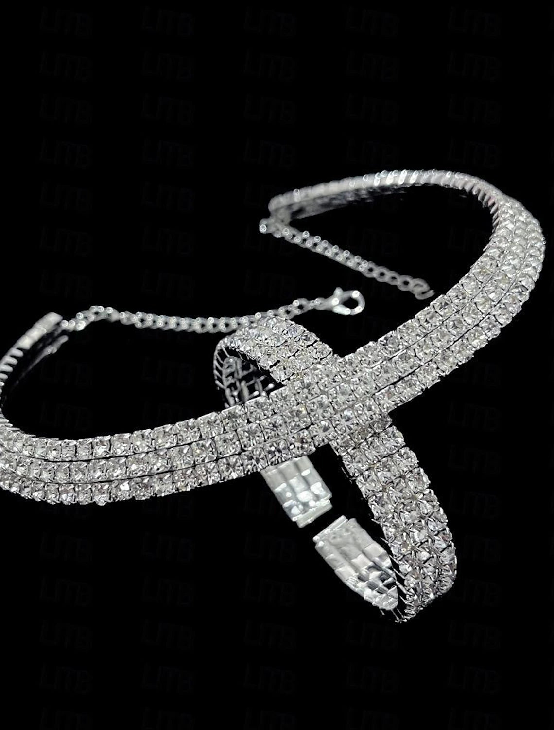 Elegant women's alloy jewelry set displayed, showcasing the necklace, earrings, and bracelet.