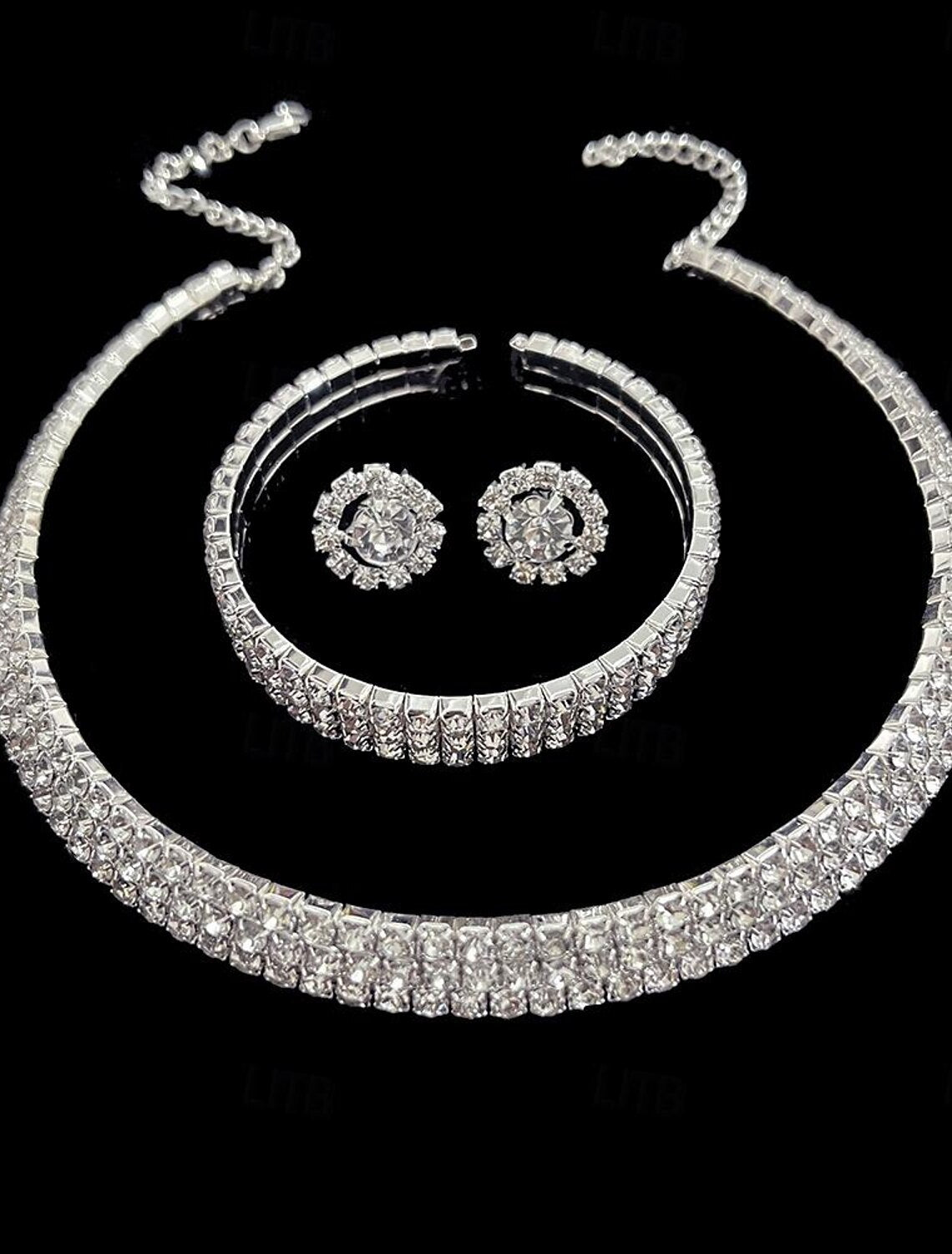 Close-up of the alloy necklace pendant with intricate flower and pear-round design.