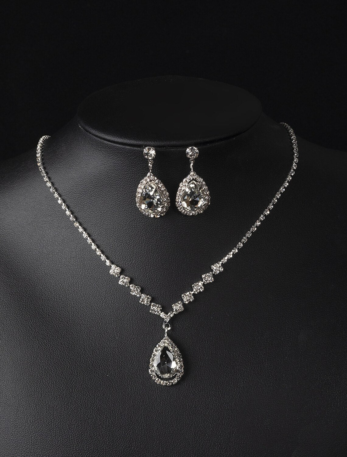 Close-up of alloy water drop necklace with briolette accents.