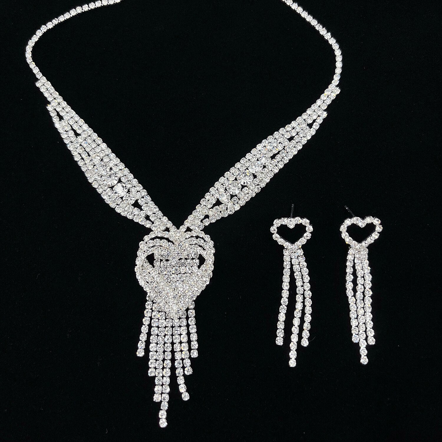 Close-up of an alloy heart tassel necklace.