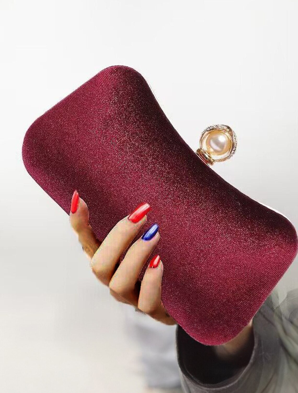 Back view of the corduroy clutch evening bag with its chain strap.