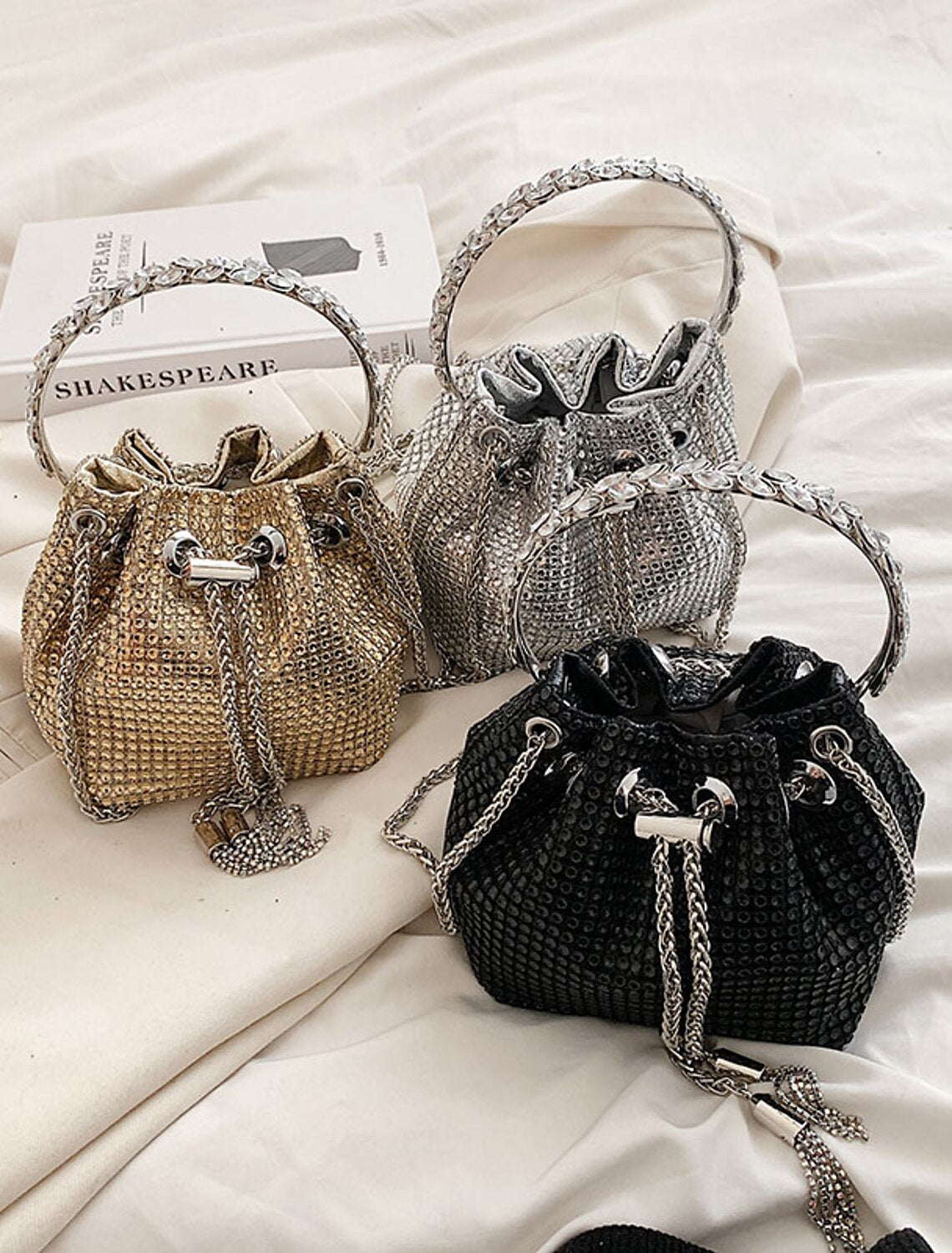 Women's crystal evening bucket clutch bag, front view.