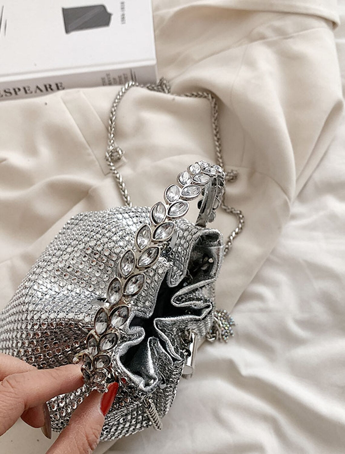 Close-up of the shimmering crystal embellishments on the evening clutch.