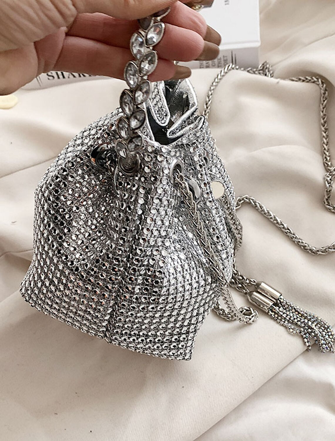 Women's large capacity crystal bucket bag, showcasing its structured design.