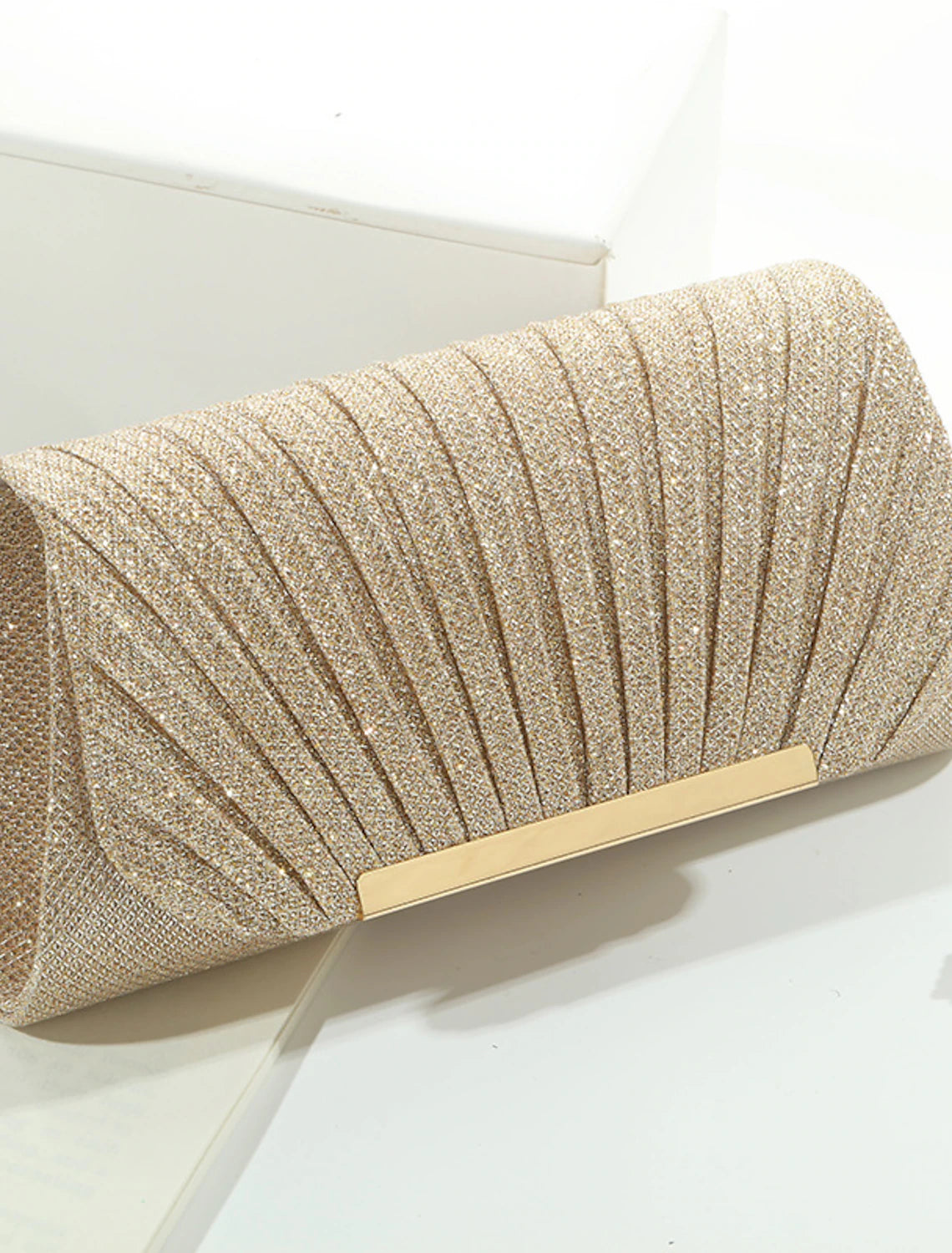 Sparkling crystal evening clutch bag with a chain strap.