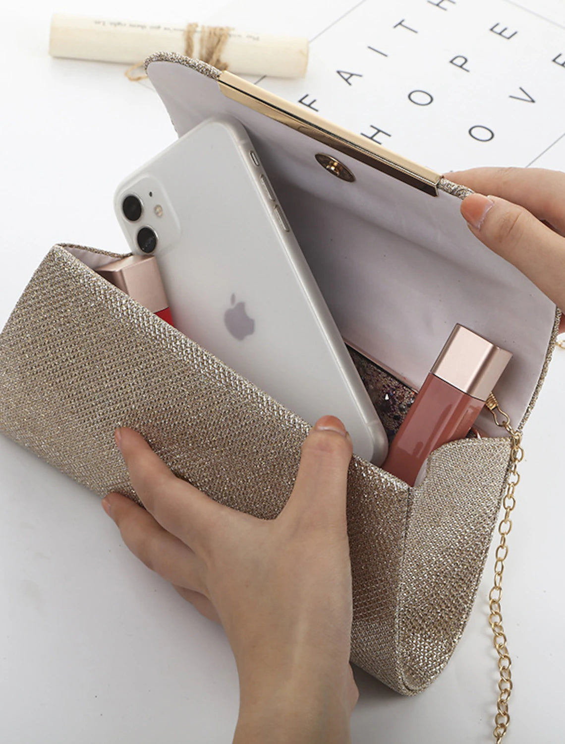 Polyester evening bag with crystal detailing and chain.