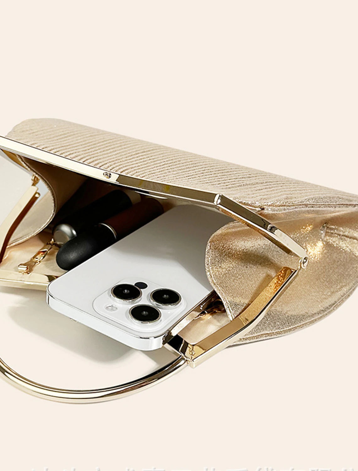 Women's formal clutch bag with a delicate chain strap.