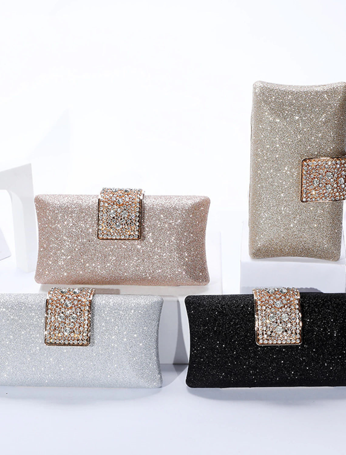 Elegant solid color crystal clutch bag with a delicate chain.