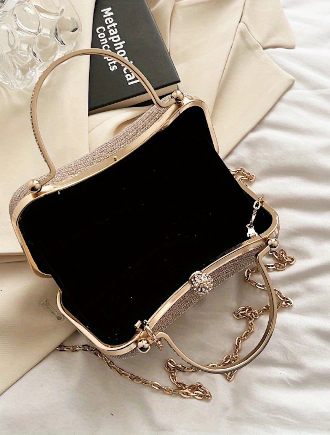Rhinestone chain detail on the elegant evening clutch.