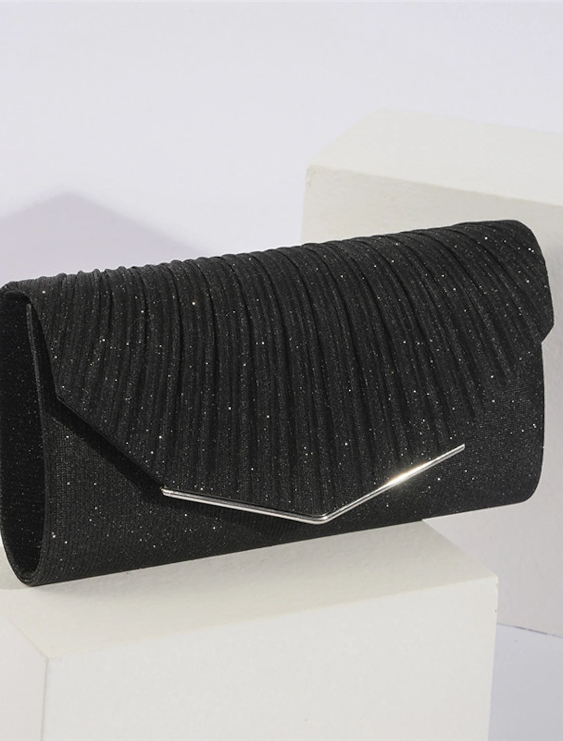 Evening bag with detachable chain strap.