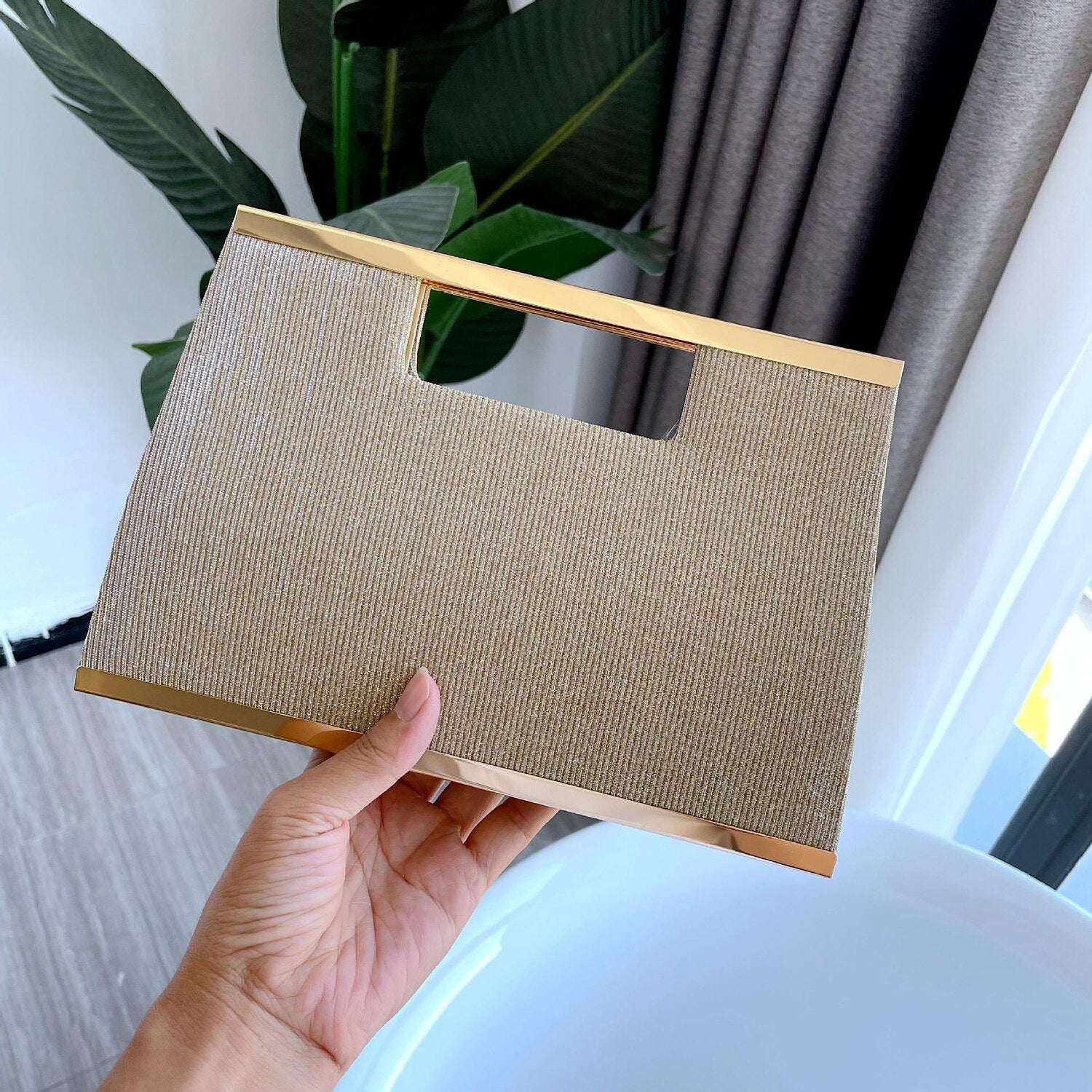 Women's clutch bag with a secure clasp.