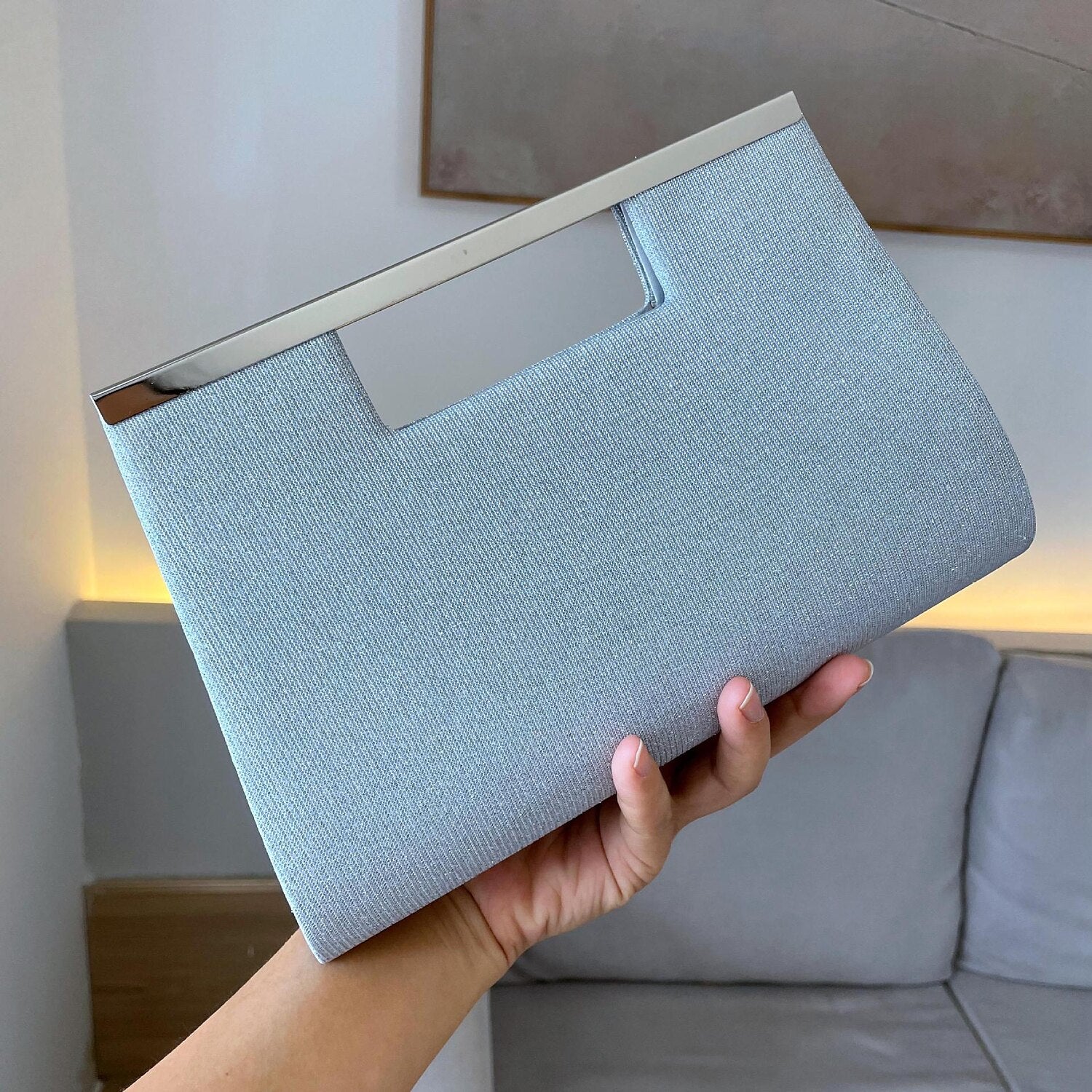 Front view of a stylish synthetic evening bag.