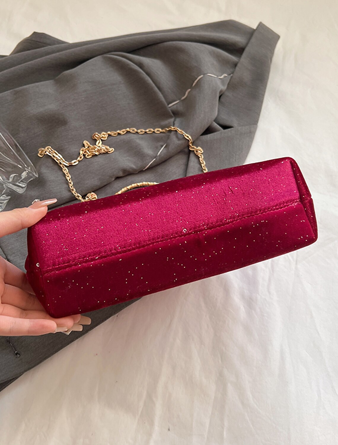 Side profile of the large capacity geometric nylon clutch bag.