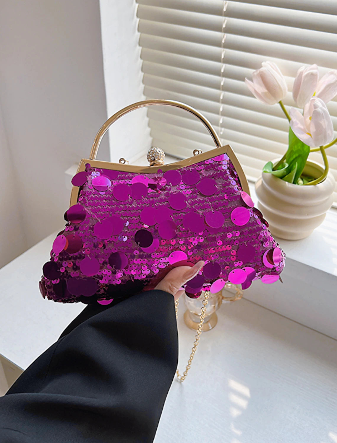 Folded geometric sequin evening bag.