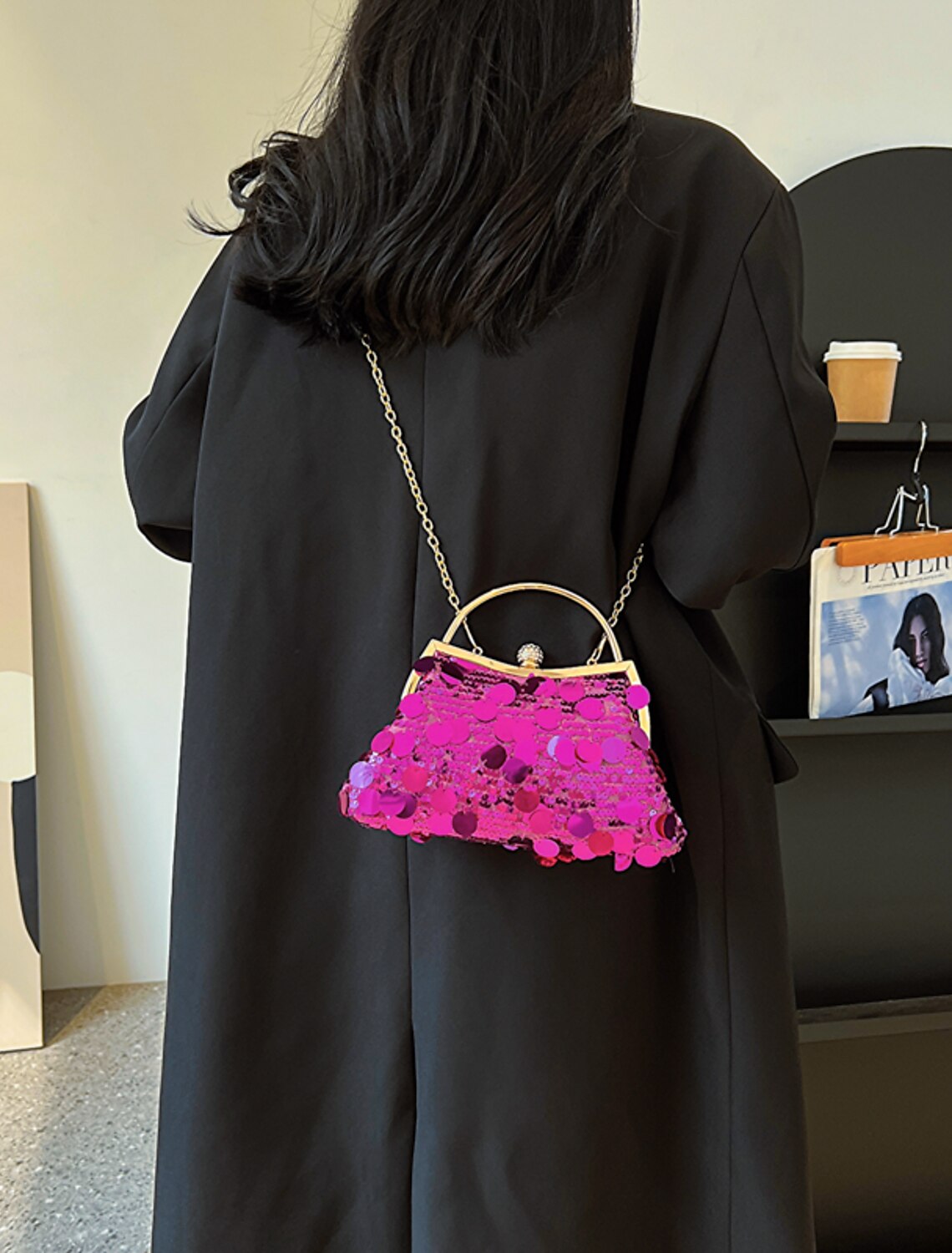Detail of tassel and sequin embellishments on evening bag.
