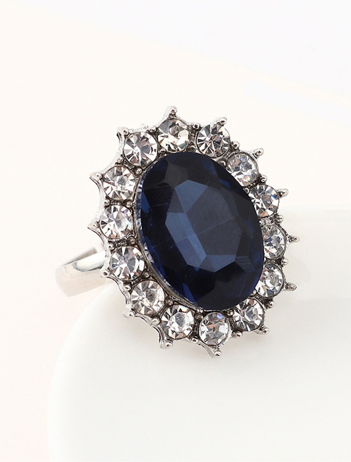 Close-up of the geometrical alloy ring with intricate detailing.