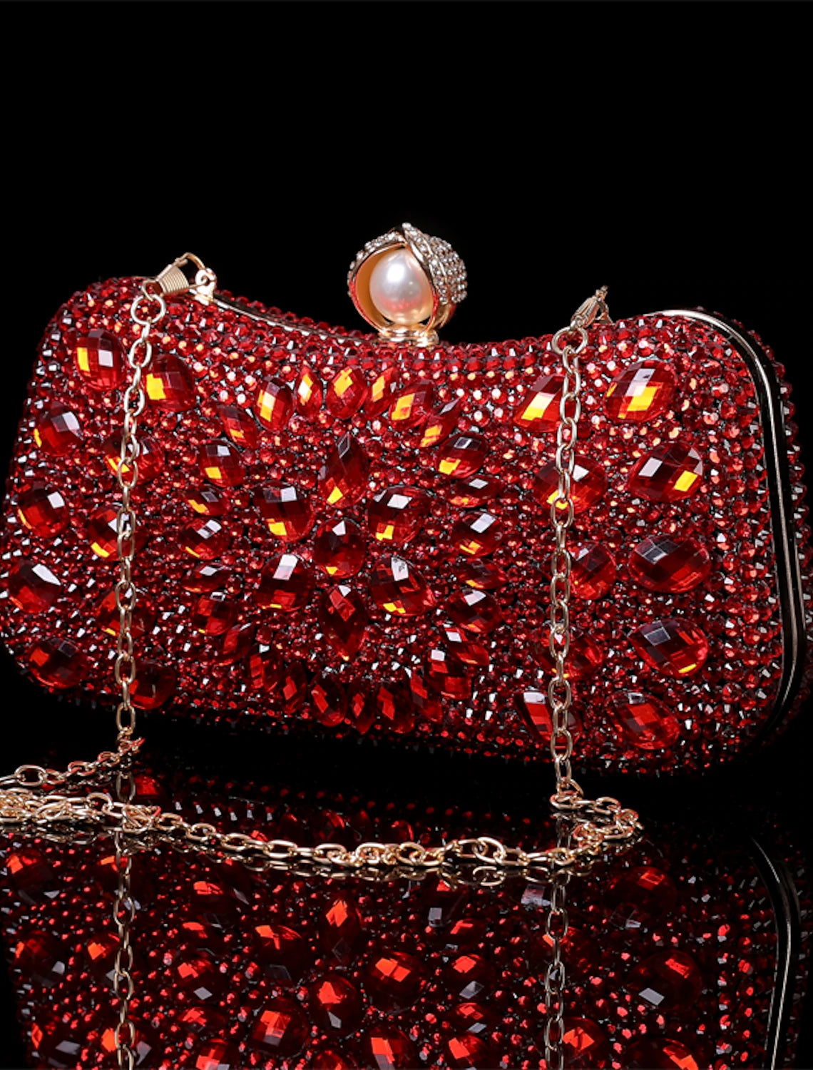 Women's hand holding the shimmering glitter crystal clutch.