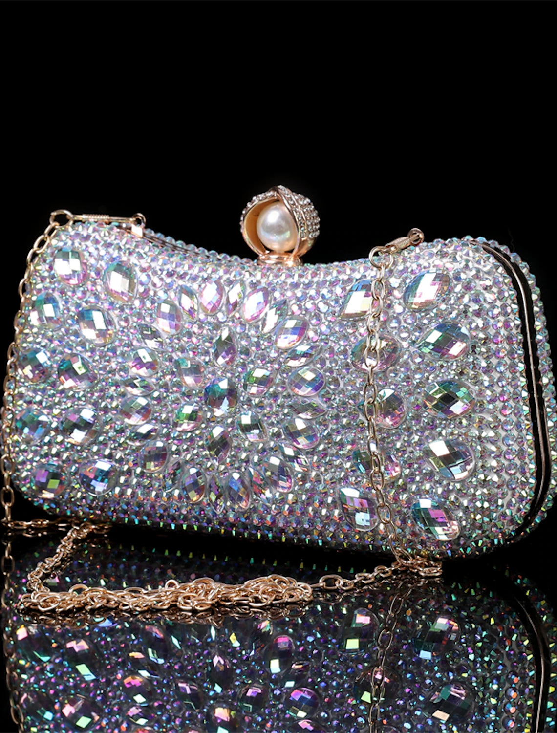 Glitter crystal clutch and purse set displayed on a surface.