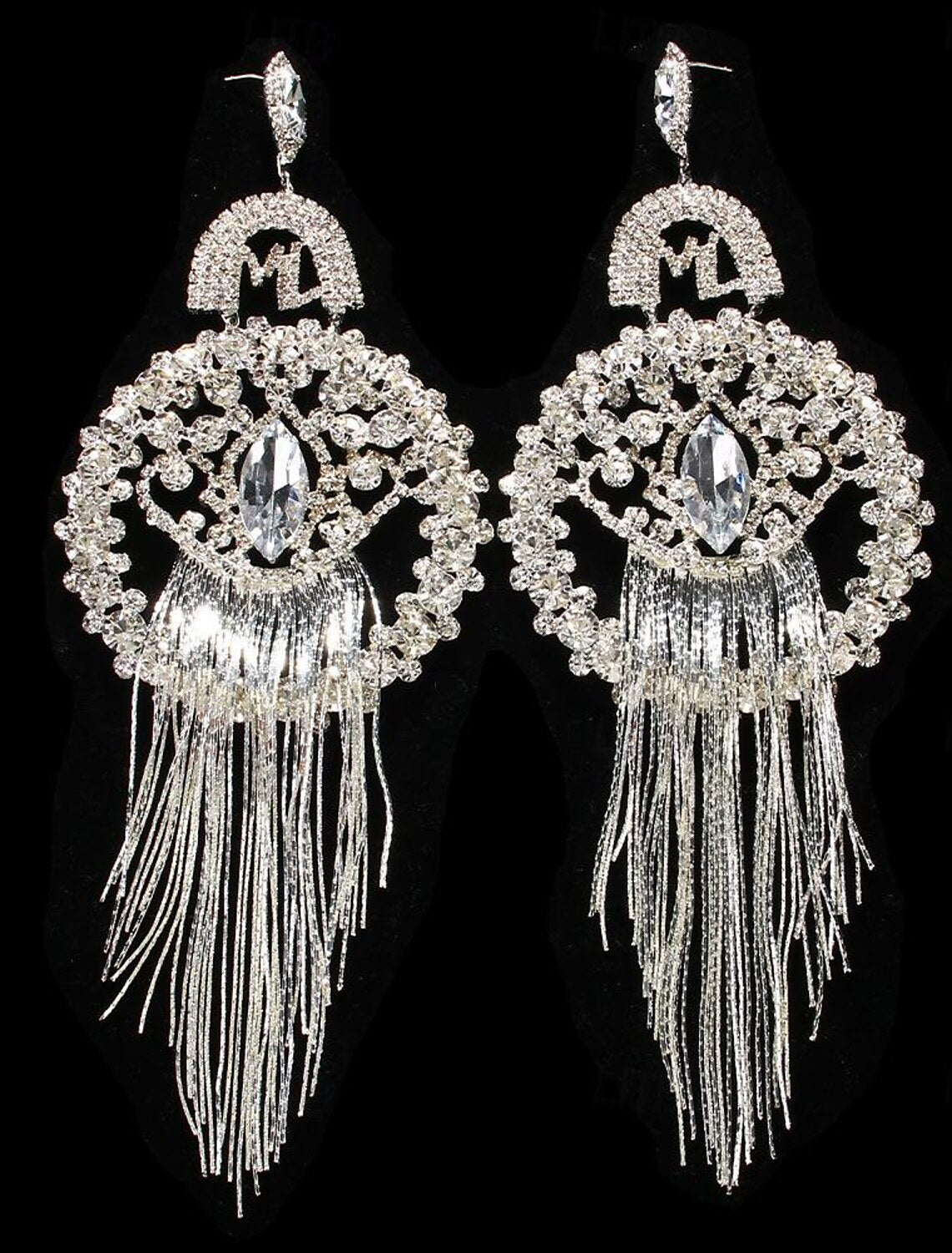 Pair of women's imitation diamond hoop earrings in gold tone.