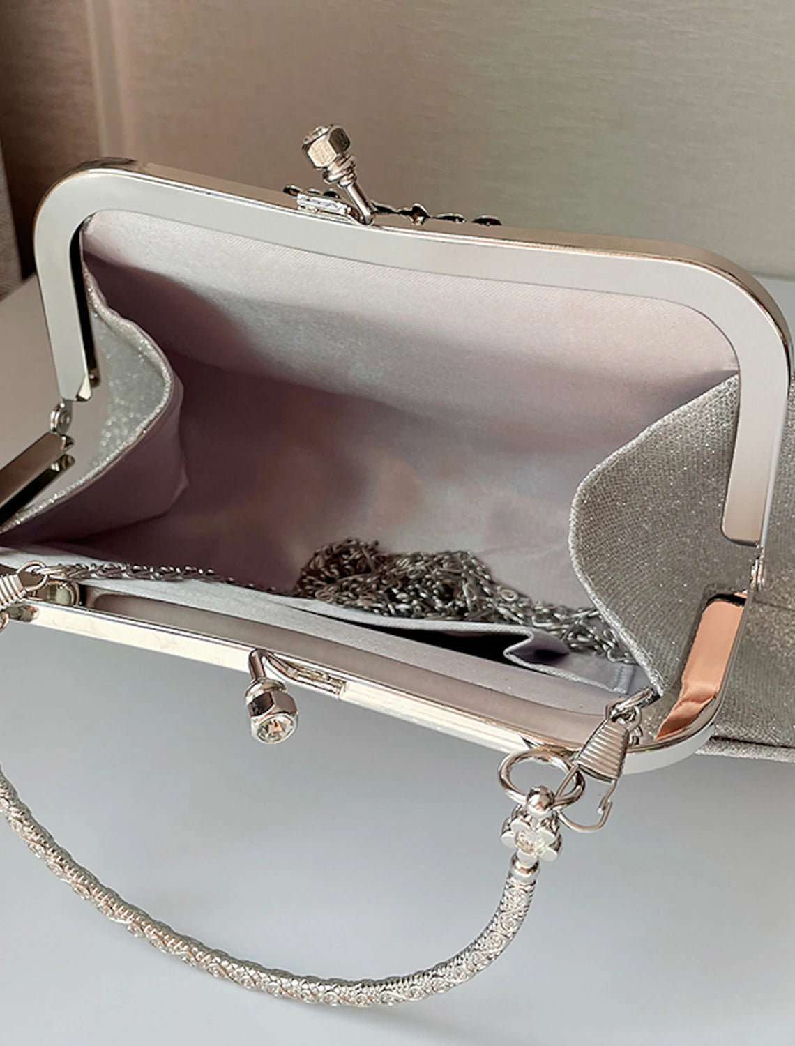 Women's evening clutch bag with a subtle texture.