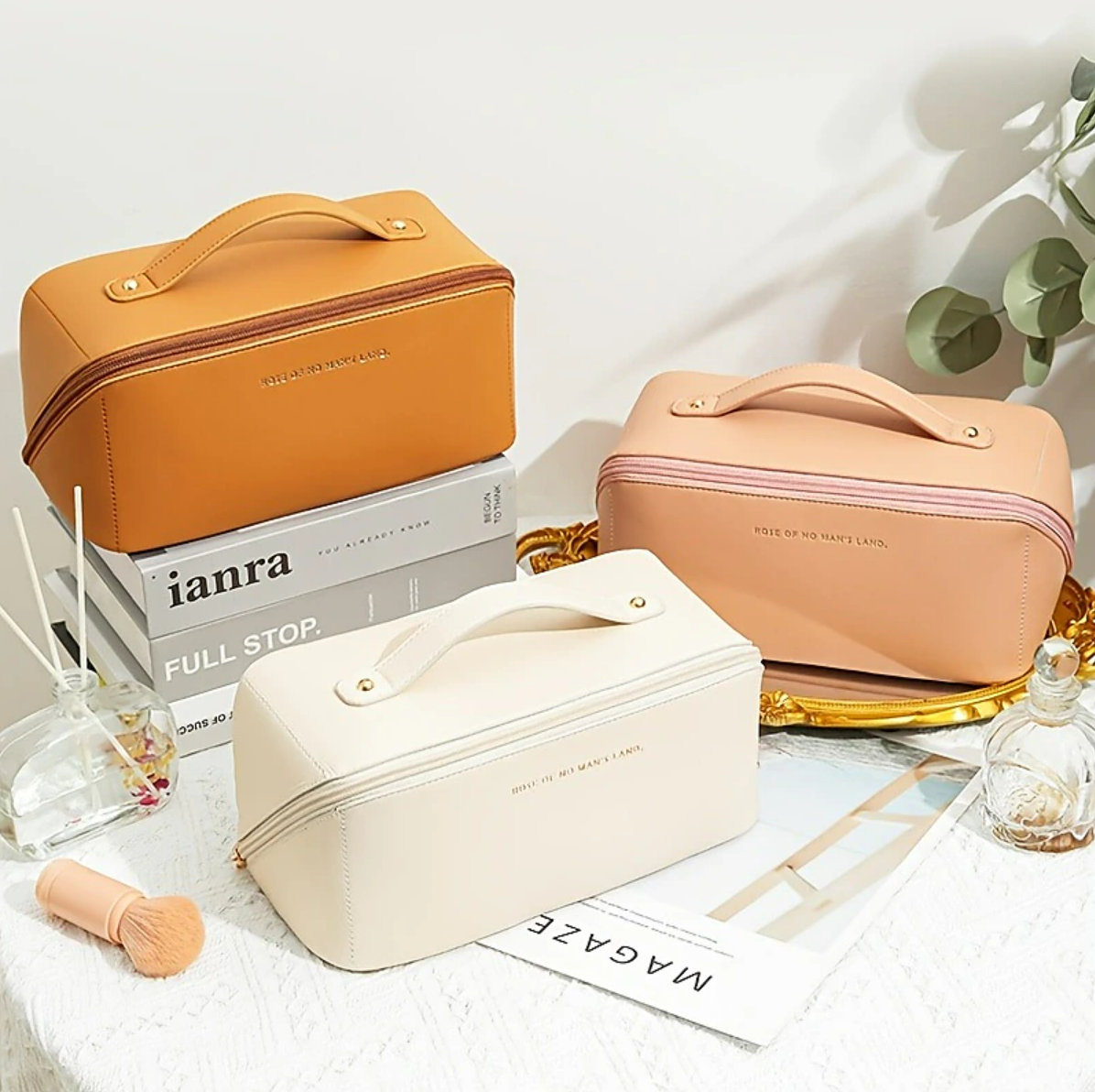 An open women's cosmetic bag showing its spacious interior and compartments.