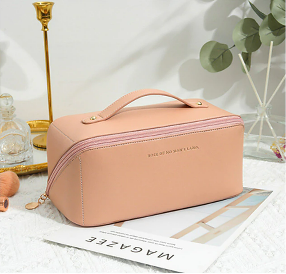 A women's cosmetic bag, closed, with a focus on its texture and design.