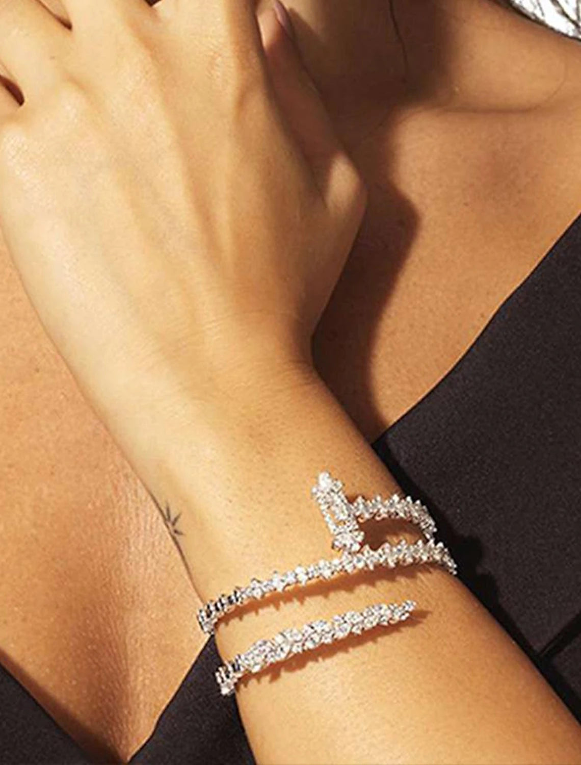 Women's layered rhinestone tennis bracelet in silver tone.