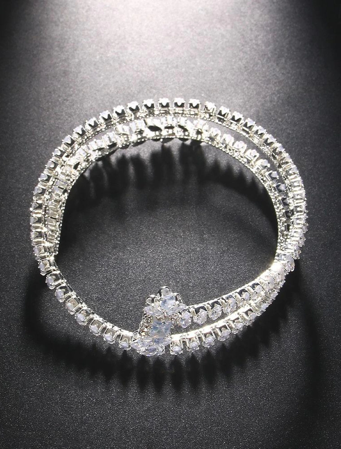 Women's layered rhinestone tennis bracelet in gold tone.