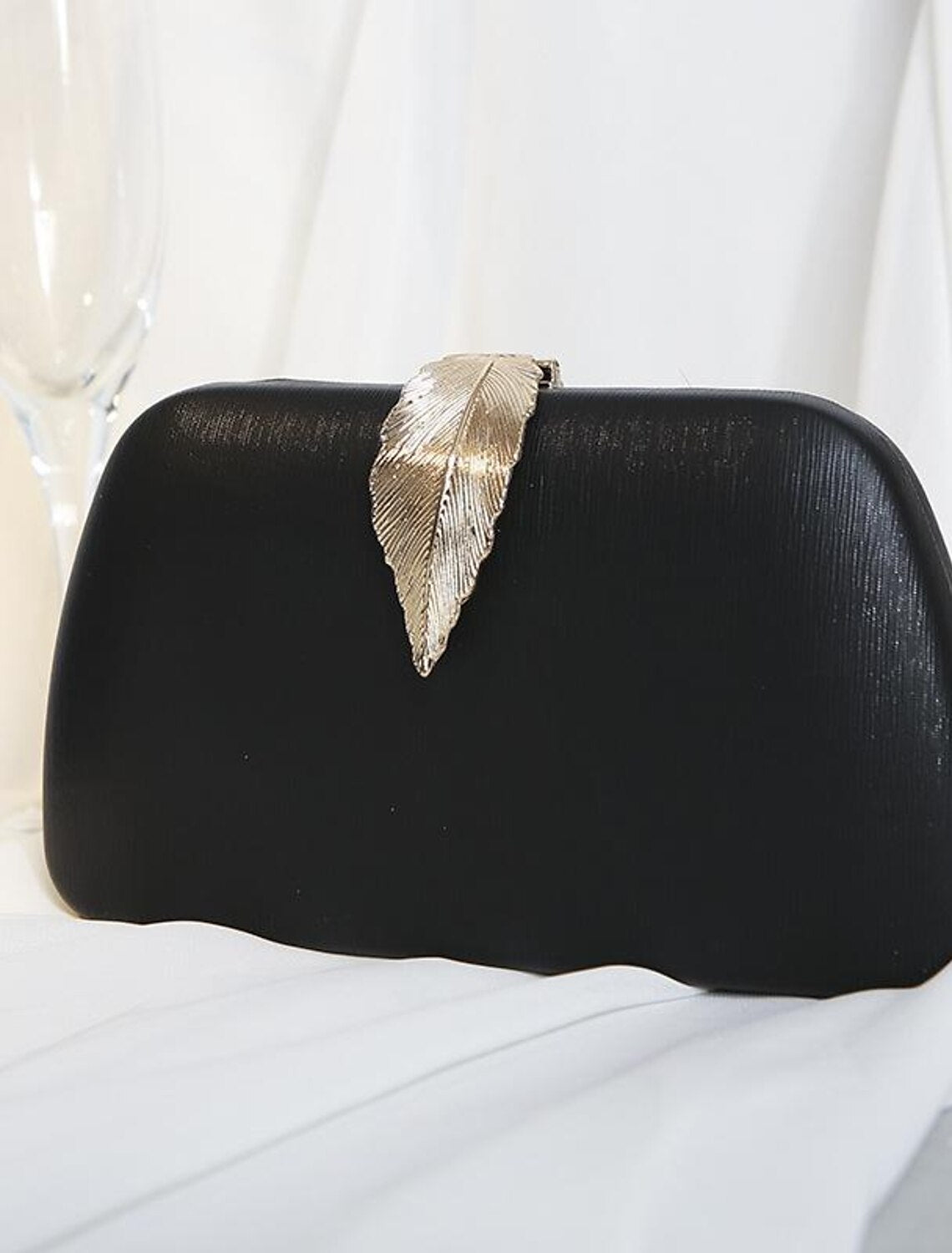 Front view of a women's elegant polyester clutch bag.