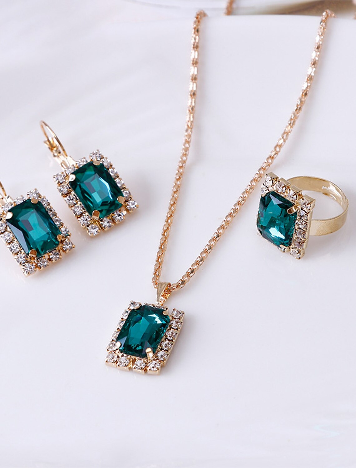 Rhinestone alloy ring with a geometric pattern.
