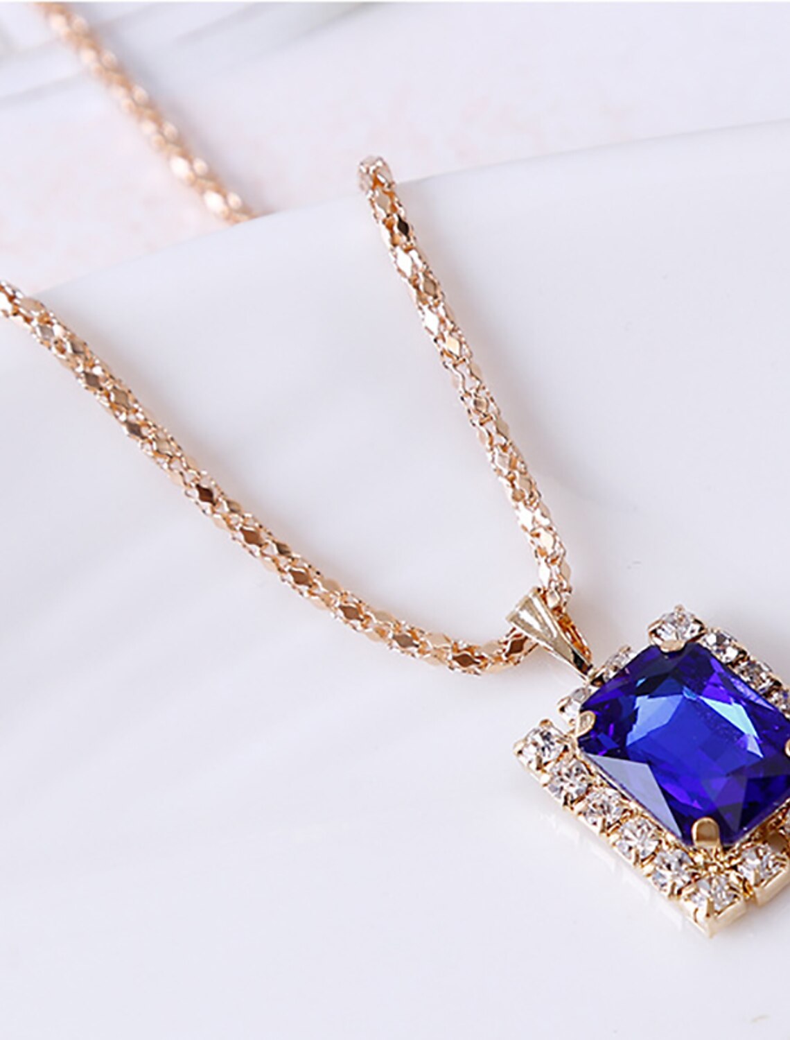 Detailed view of the rhinestone alloy ring.